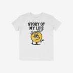 Story Of My Life Shirt with distressed lettering and a droopy-eyed smiley face, humorously capturing life's chaos and struggles. Features a raised shrugging arm and dizziness swirl above the head.