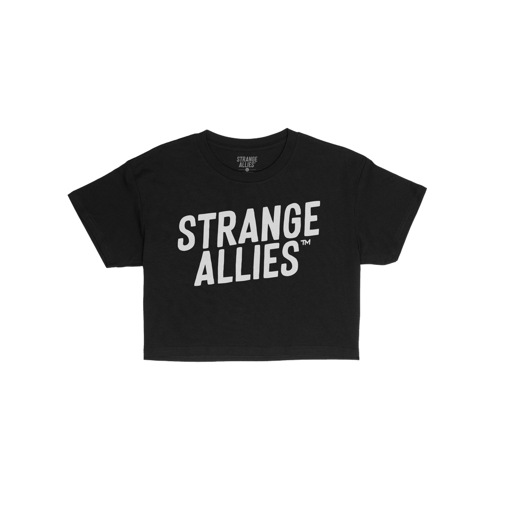 The Strange Allies Women's Baby Tee features bold white STRANGE ALLIES™ text on a black crew-neck design, celebrating indiv