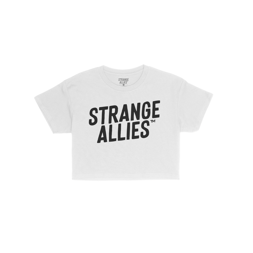 Strange Allies Women's Baby Tee features bold STRANGE ALLIES™ text on a white, fitted, cropped crew-neck, embodying defianc