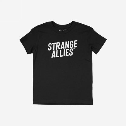 Strange Allies T-shirt featuring bold “STRANGE ALLIES™” text on chest, laid flat. This classic crew-neck tee embodies outsider ethos, inviting wearers to embrace uniqueness and individuality.