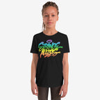 Young person wearing the Strange Allies Rainbow Handstyle T-shirt featuring a vibrant graffiti design with STRANGE ALLIES text, embodying bold individuality and inclusivity. The tee is paired with dark pants.