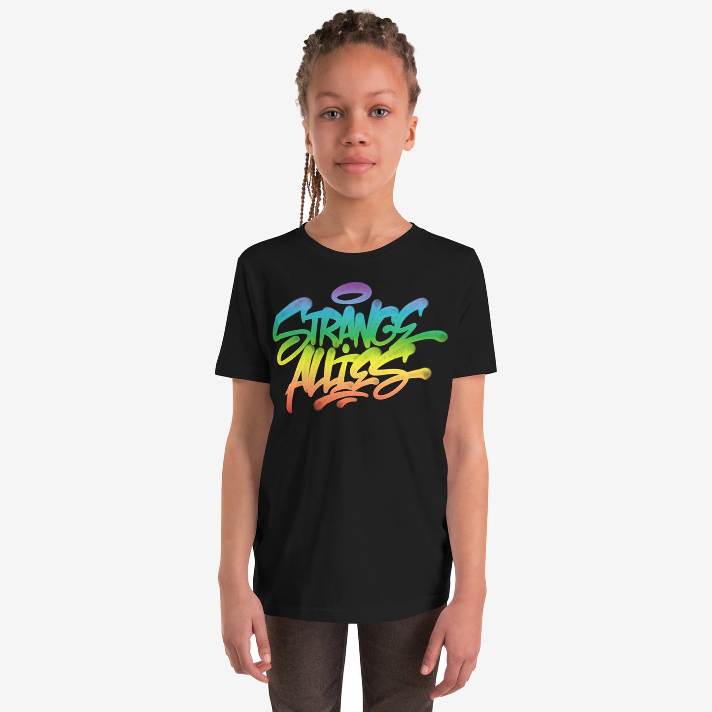 Young person wearing the Strange Allies Rainbow Handstyle T-shirt featuring a vibrant graffiti design with STRANGE ALLIES text, embodying bold individuality and inclusivity. The tee is paired with dark pants.