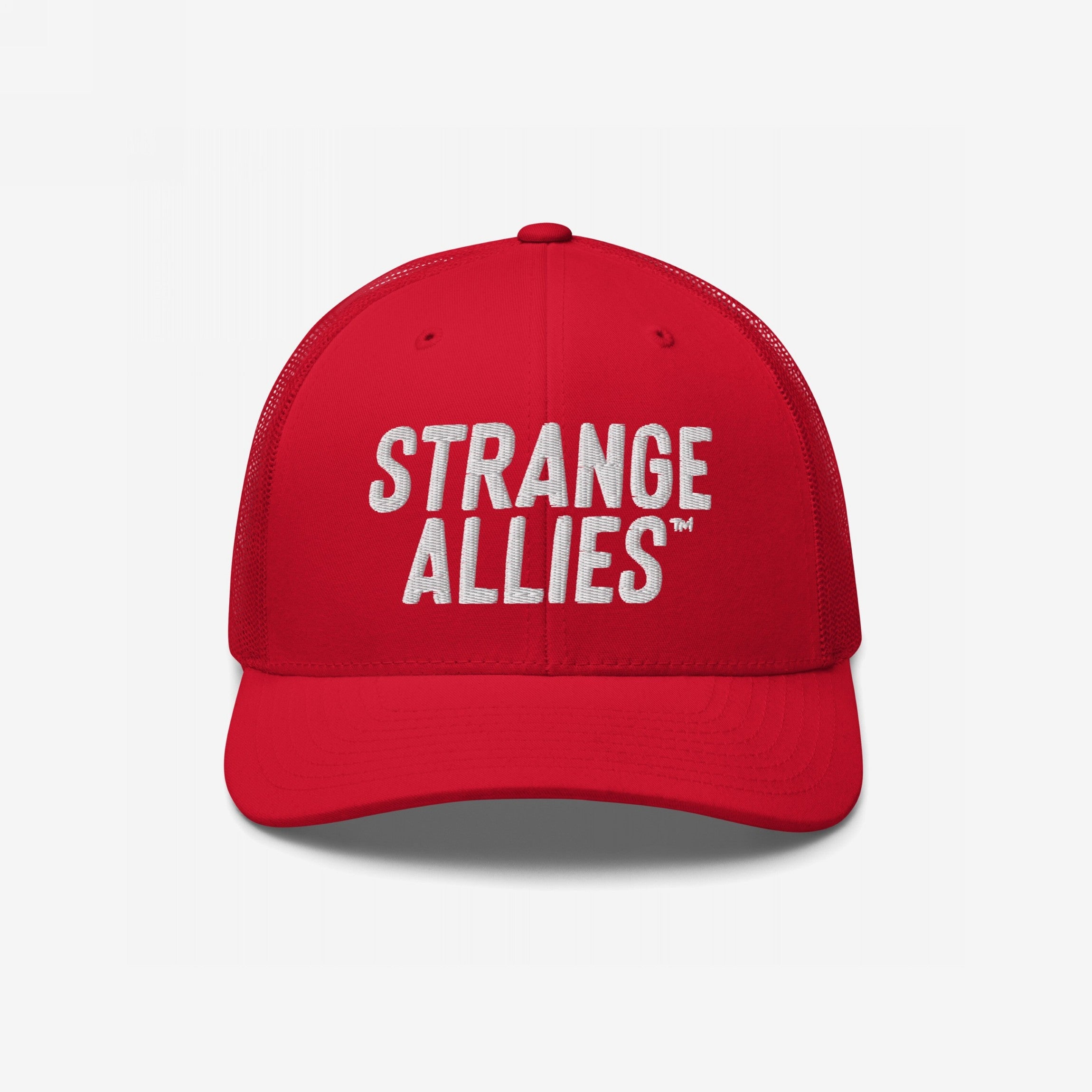 Bright red trucker-style baseball cap featuring the phrase “STRANGE ALLIES™” in white embroidery, symbolizing unity in diversity.