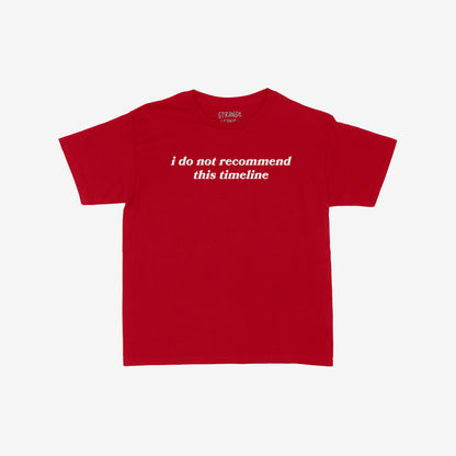Timeline Women's Baby Tee featuring a sardonic serif-style slogan, “i do not recommend this timeline.”, captures minimalist sarcasm with retro flair, laid flat showcasing its cropped, short-sleeved design.
