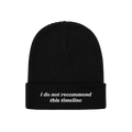 Black rib-knit beanie, Timeline Hat, features folded cuff with white embroidery: “i do not recommend this timeline.” Perf