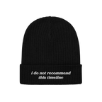 Black rib-knit beanie, Timeline Hat, features folded cuff with white embroidery: “i do not recommend this timeline.” Perf