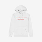 Plain white Timeline Shirt hoodie with red serif text stating “i do not recommend this timeline,” capturing humor and critique, reflecting disillusionment and vintage flair. Features kangaroo pocket and drawstring hood.
