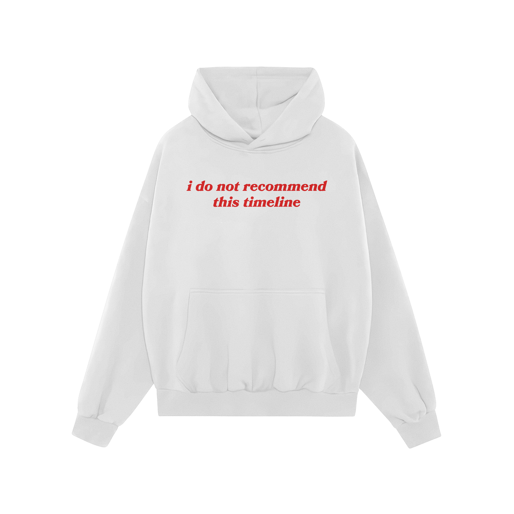 Plain white Timeline Shirt hoodie with red serif text stating “i do not recommend this timeline,” capturing humor and cri