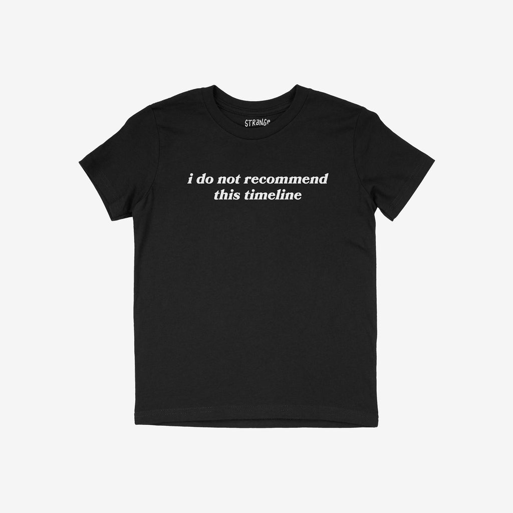 Black short-sleeved crew-neck Timeline Shirt with “i do not recommend this timeline” in white text on the chest, conveying humor and critique for skeptics and realists.