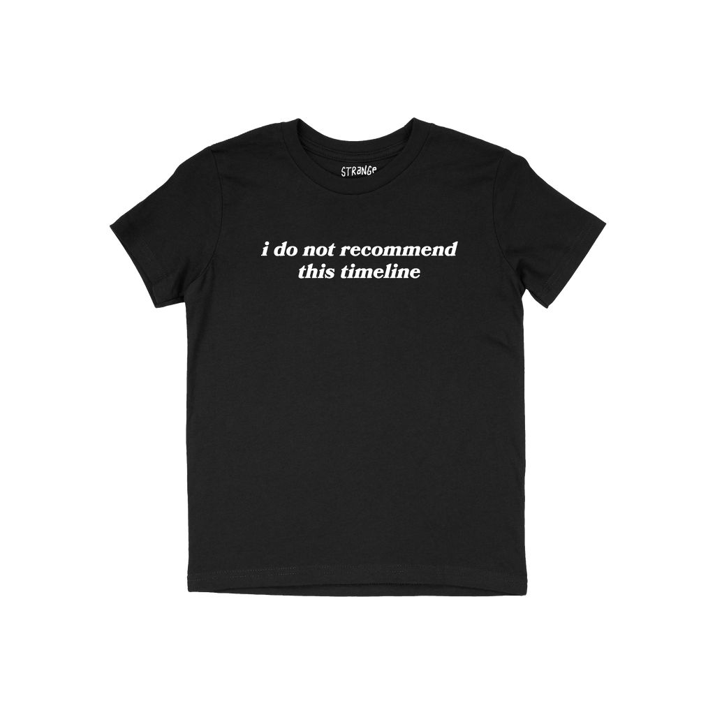 Black short-sleeved crew-neck Timeline Shirt with “i do not recommend this timeline” in white text on the chest, conveyin
