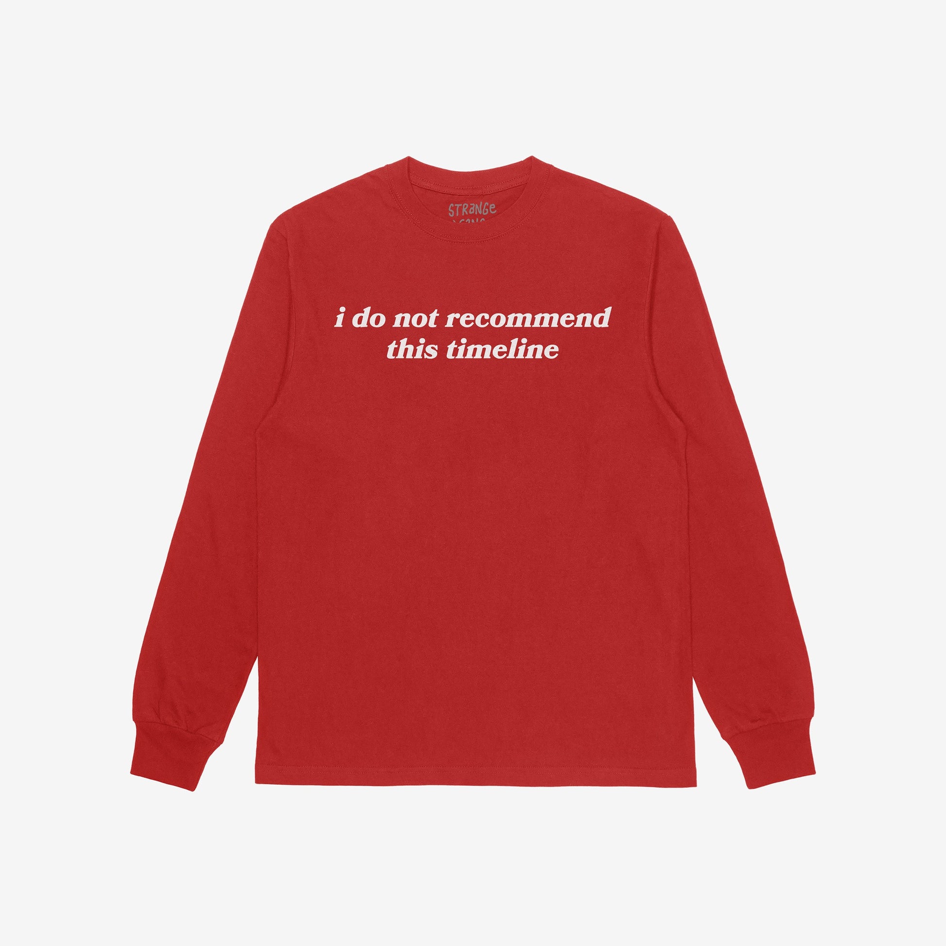Red long-sleeve crewneck T-shirt with i do not recommend this timeline in white serif lettering, showcasing sarcastic style and existential commentary, known as the Timeline T-shirt.