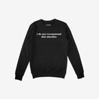 Black crewneck sweatshirt featuring I do not recommend this timeline in white. The Timeline Shirt humorously critiques modern absurdities, resonating with skeptics and realists. Supports NAMI.