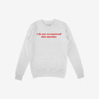 White crewneck sweatshirt featuring i do not recommend this timeline in red, reflecting humor and critique. Ideal for skeptics and realists, supporting mental health awareness through NAMI donations.