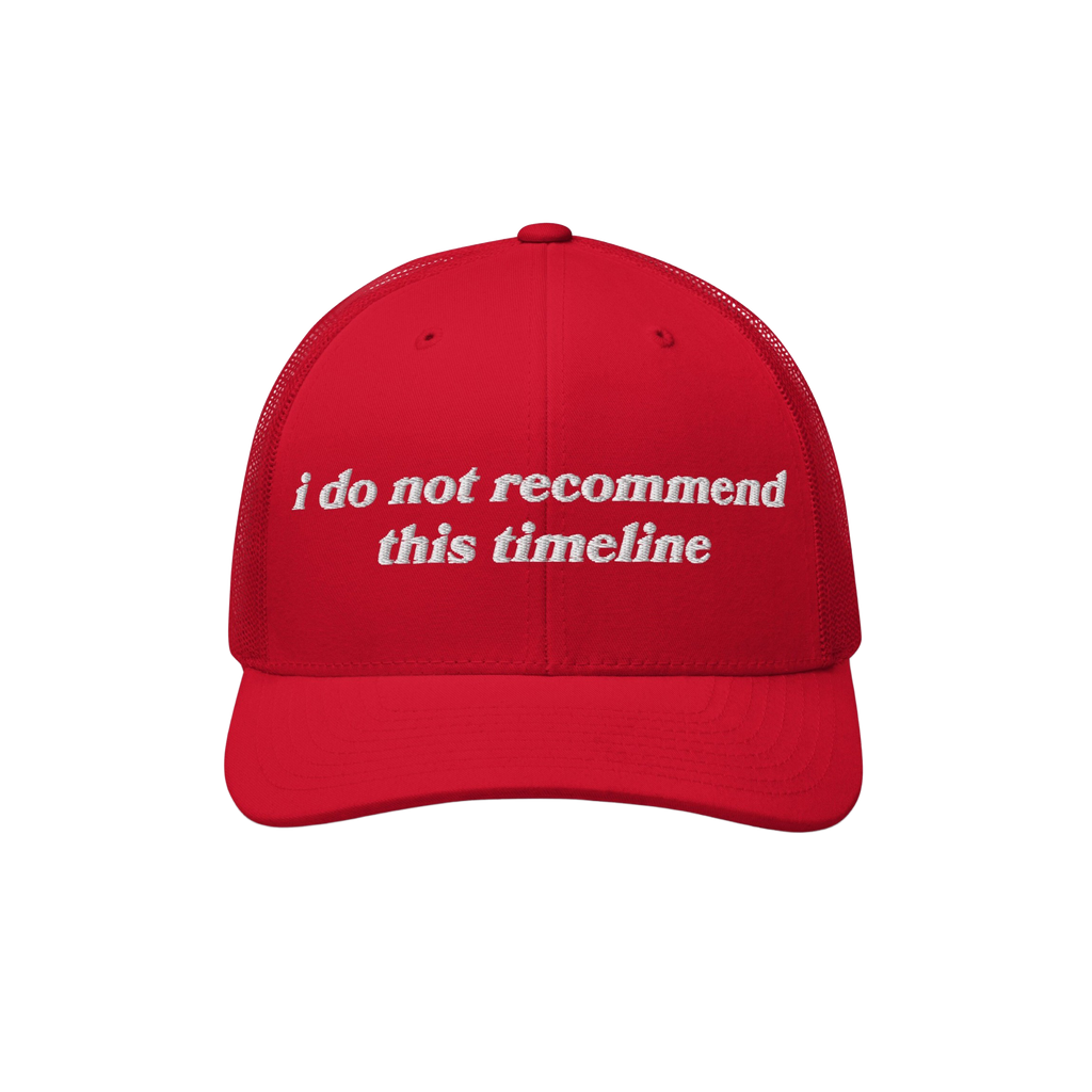 Red trucker-style baseball cap with white text i do not recommend this timeline on front, embodying political humor and sarca