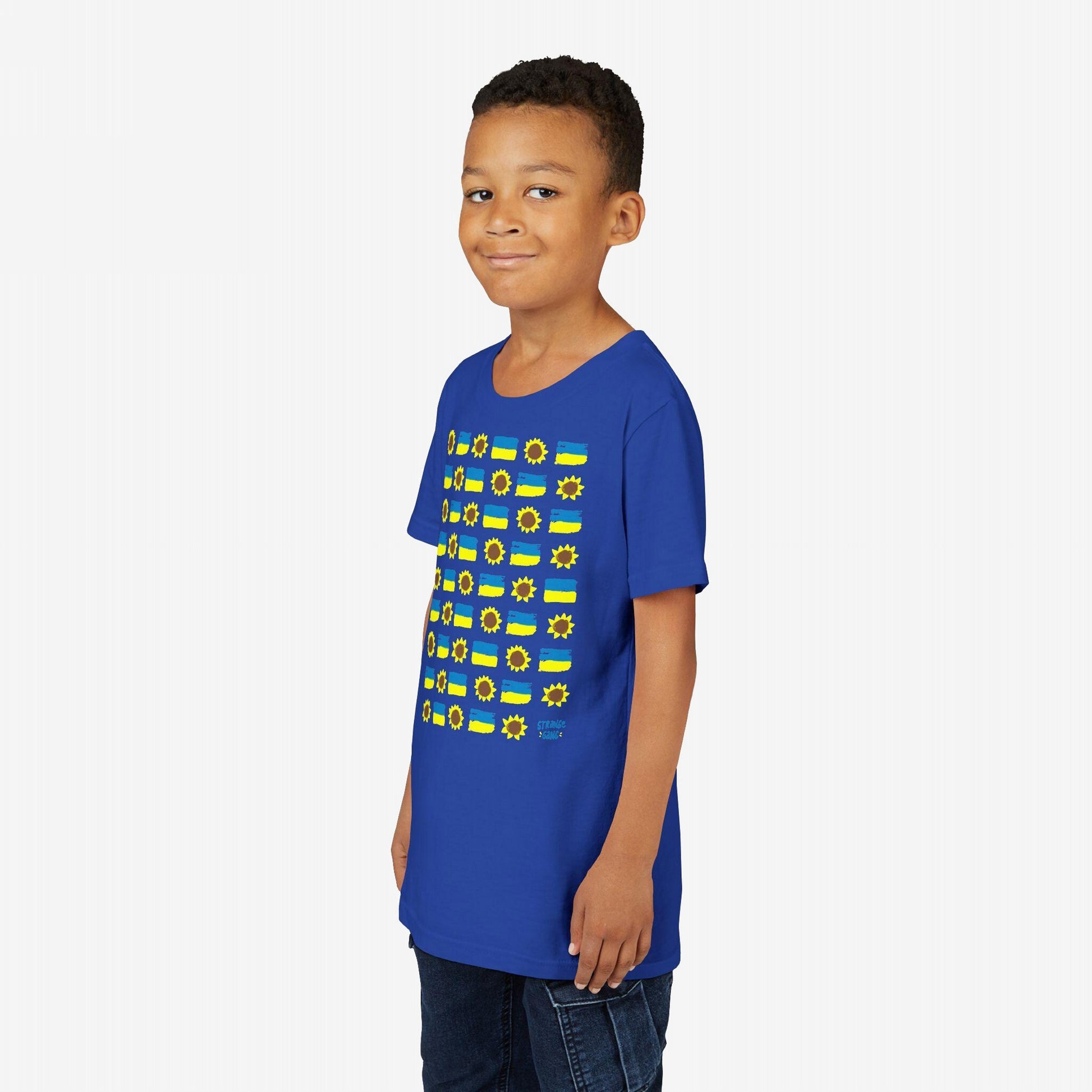 Young boy models a Ukraine Sunflowers T-shirt, featuring hand-drawn sunflowers and Ukrainian flags, symbolizing resilience and unity. The shirt supports peace and solidarity, reflecting the store's advocacy for equality.