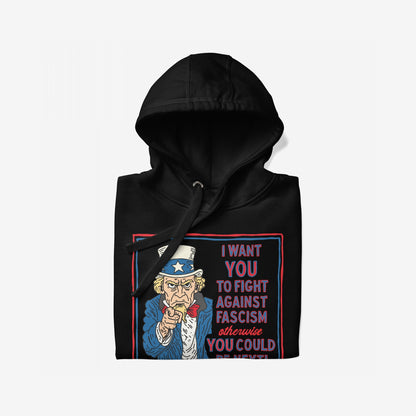 Anti-Fascist Uncle Sam Hoodie featuring a bold Uncle Sam graphic urging to fight fascism. The design, with red-and-blue text, highlights activism and resistance on a neatly folded black sweatshirt.