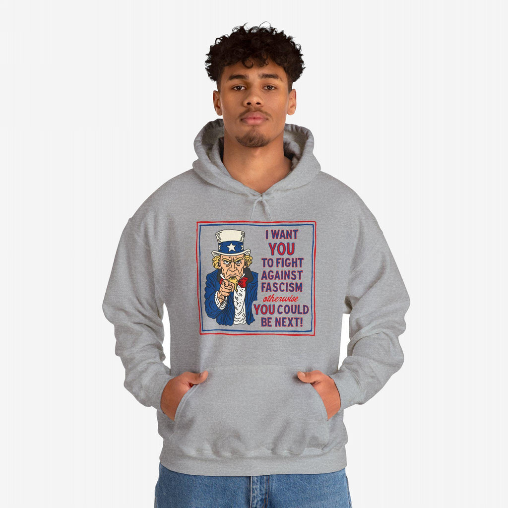 Young man wears the Anti Fascist Uncle Sam Hoodie featuring a bold graphic of Uncle Sam with a message urging resistance against fascism. Ideal for activists supporting equality and justice.