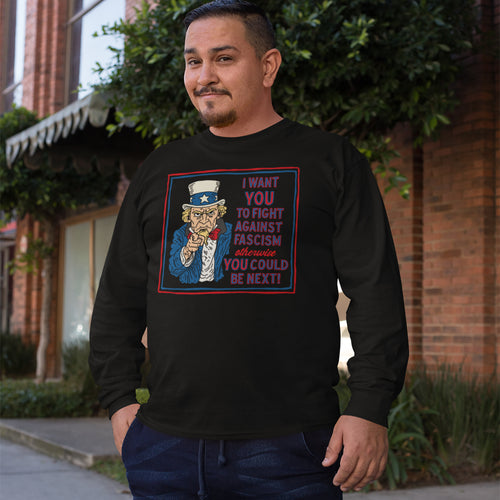 Man wearing an Anti Fascist Uncle Sam Shirt with a bold illustration of Uncle Sam and a message against fascism, embodying activist spirit.