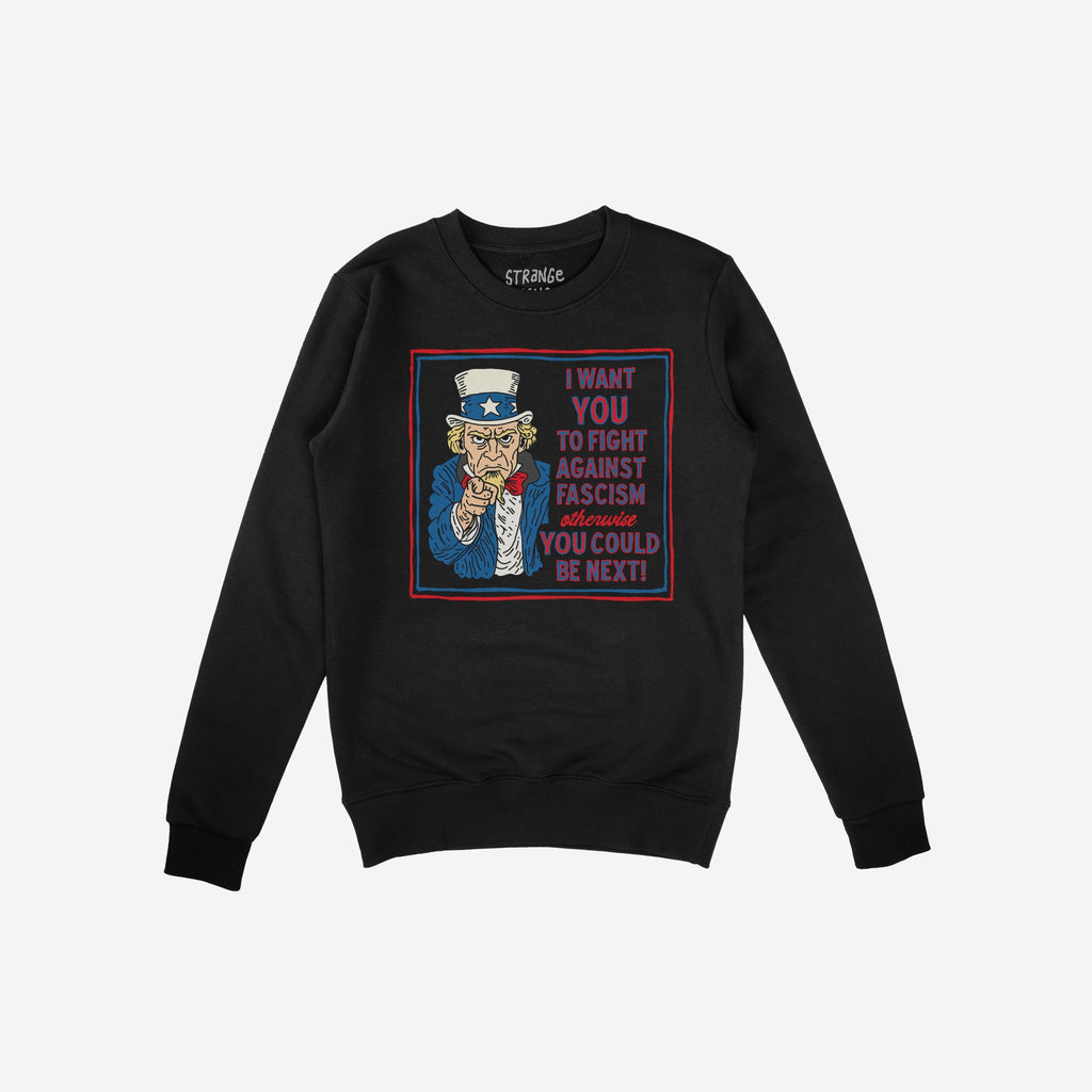Black crewneck sweatshirt featuring the Anti Fascist Uncle Sam Shirt design, with Uncle Sam pointing and a bold message urging action against fascism. Brand name visible inside the collar.