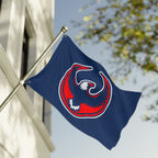 USA Rebel Alliance Flag featuring a stylized eagle emblem on a blue background, mounted on a metal pole in front of a building, symbolizing solidarity and resistance.