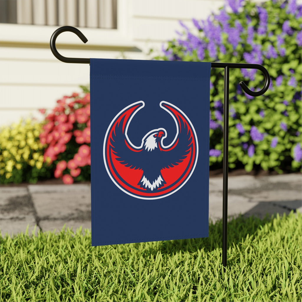 USA Rebel Alliance Garden Flag on a black metal stake in a grassy yard, featuring a stylized eagle emblem. Perfect for expressing anti-fascist and immigrant rights support outdoors.