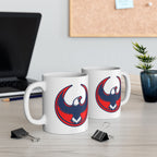 USA Rebel Alliance Mug featuring a red and navy stylized eagle logo on a white ceramic surface, positioned on a light-wood desk with a workspace backdrop, embodying anti-fascist and patriotic themes.