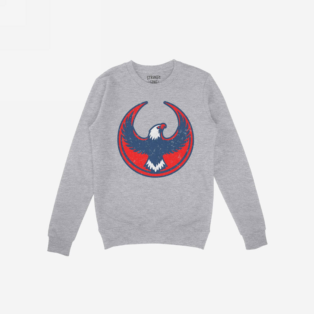 Light-gray USA Rebel Alliance crewneck sweatshirt featuring a bold red, navy, and white circular eagle graphic, symbolizing defiant patriotism and protest, perfect for those questioning America's path.