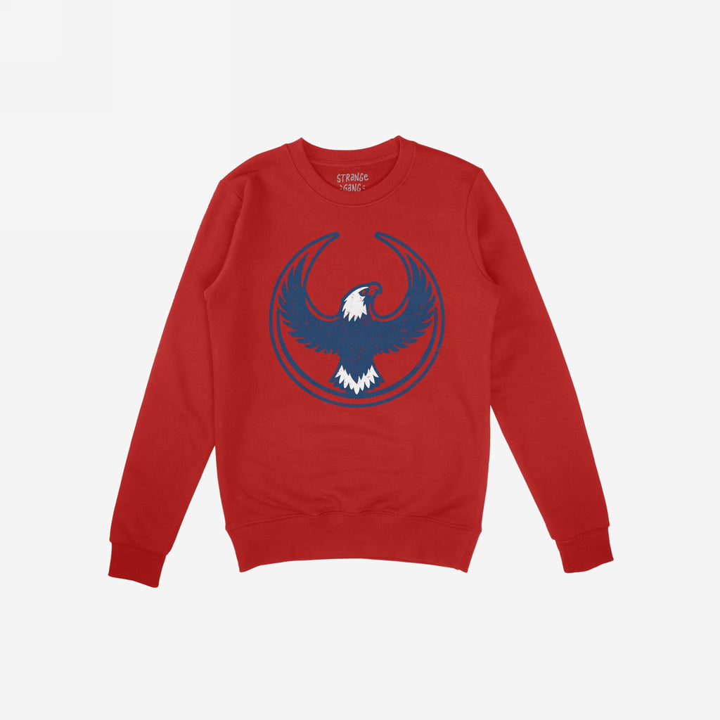 USA Rebel Alliance crewneck sweatshirt features a red base with a blue and white stylized eagle graphic, embodying defiance and patriotism for those who question and resist.