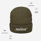 Useless Hat: Olive green beanie with useless in Old English embroidery, flanked by yellow starbursts on the cuff. Made from recycled polyester, featuring a cuffed, double-layered, narrow-rib knit design.