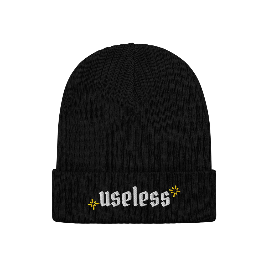 Black rib-knit beanie, labeled Useless in white Old English letters, flanked by yellow starbursts; embodies relaxation and re