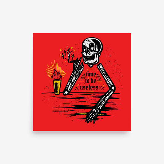 The Useless Giclée Print features a skeleton with a cigarette and drink, leaning on a counter. The phrase “time to be useless” is displayed, capturing an irreverent and bold artistic style.