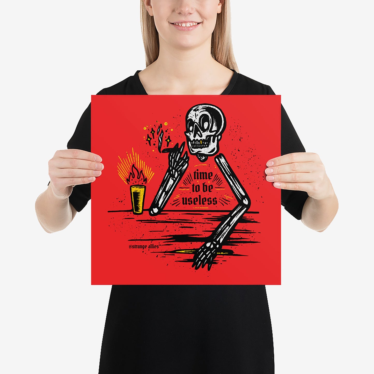 Useless Giclée Print features a stylized skeleton lounging with a lit candle, exuding a bold, vintage vibe. The words 'time to be useless' highlight its unique, rebellious charm.