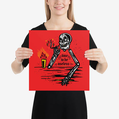 Useless Giclée Print features a stylized skeleton lounging with a lit candle, exuding a bold, vintage vibe. The words 'time to be useless' highlight its unique, rebellious charm.