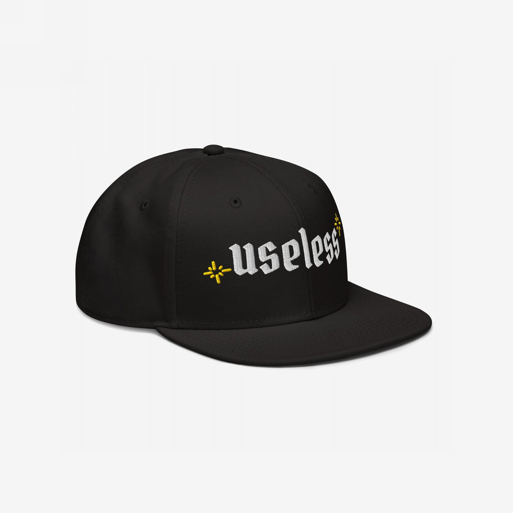 Useless Hat featuring bold, white Old English embroidery with starburst motifs. Ideal for celebrating rest and embracing a relaxed mindset.