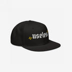 Useless Hat featuring bold, white Old English embroidery with starburst motifs. Ideal for celebrating rest and embracing a relaxed mindset.