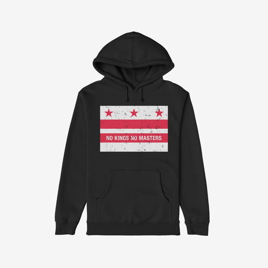 Black pullover hoodie featuring Washington DC No Kings Flag Shirt design with distressed red stars and stripes, and “NO KINGS NO MASTERS” slogan, symbolizing resistance and anti-authoritarian sentiment.