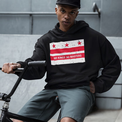 Young person on BMX bike wearing Washington DC No Kings Flag Shirt, featuring anti-authoritarian design with stars and “NO KINGS NO MASTERS” slogan, embodying bold resistance and equality.