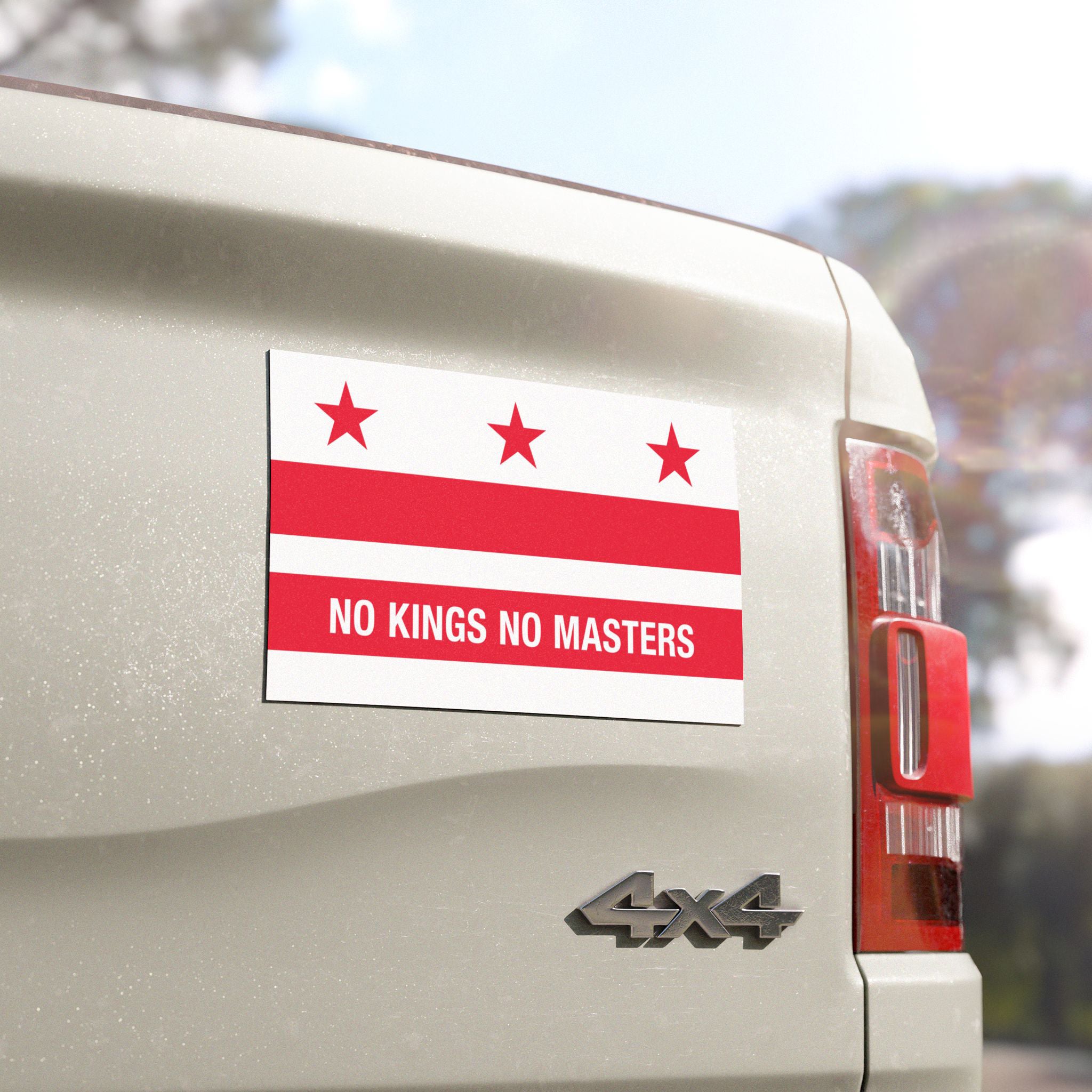 The Washington DC Flag No Kings Sticker & Magnet on a white 4×4 pickup truck tailgate, featuring bold protest text against power, symbolizing resilience and advocacy for equality.