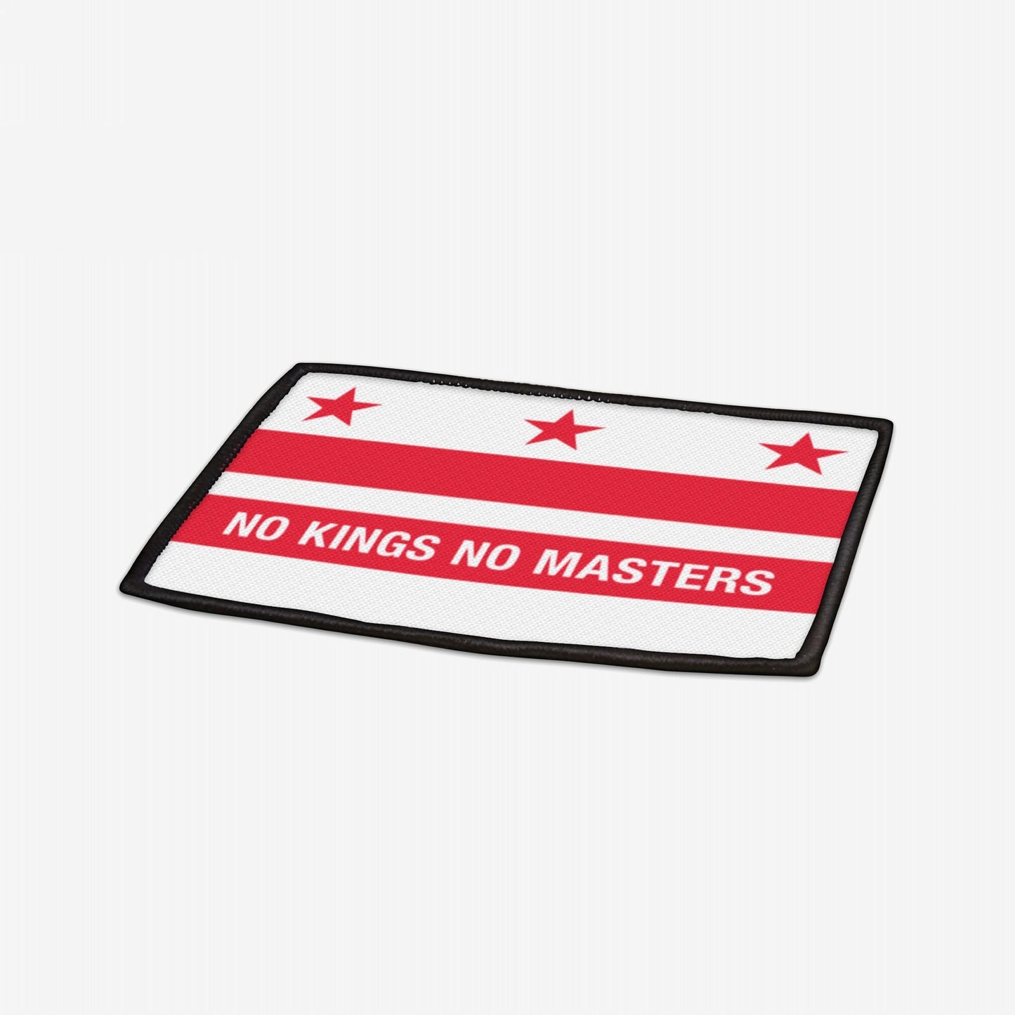 Washington DC Flag No Kings Patch featuring three red stars and two red bars, with NO KINGS NO MASTERS on the lower bar, symbolizing resistance and equality. Iron-on polyester with black edges.