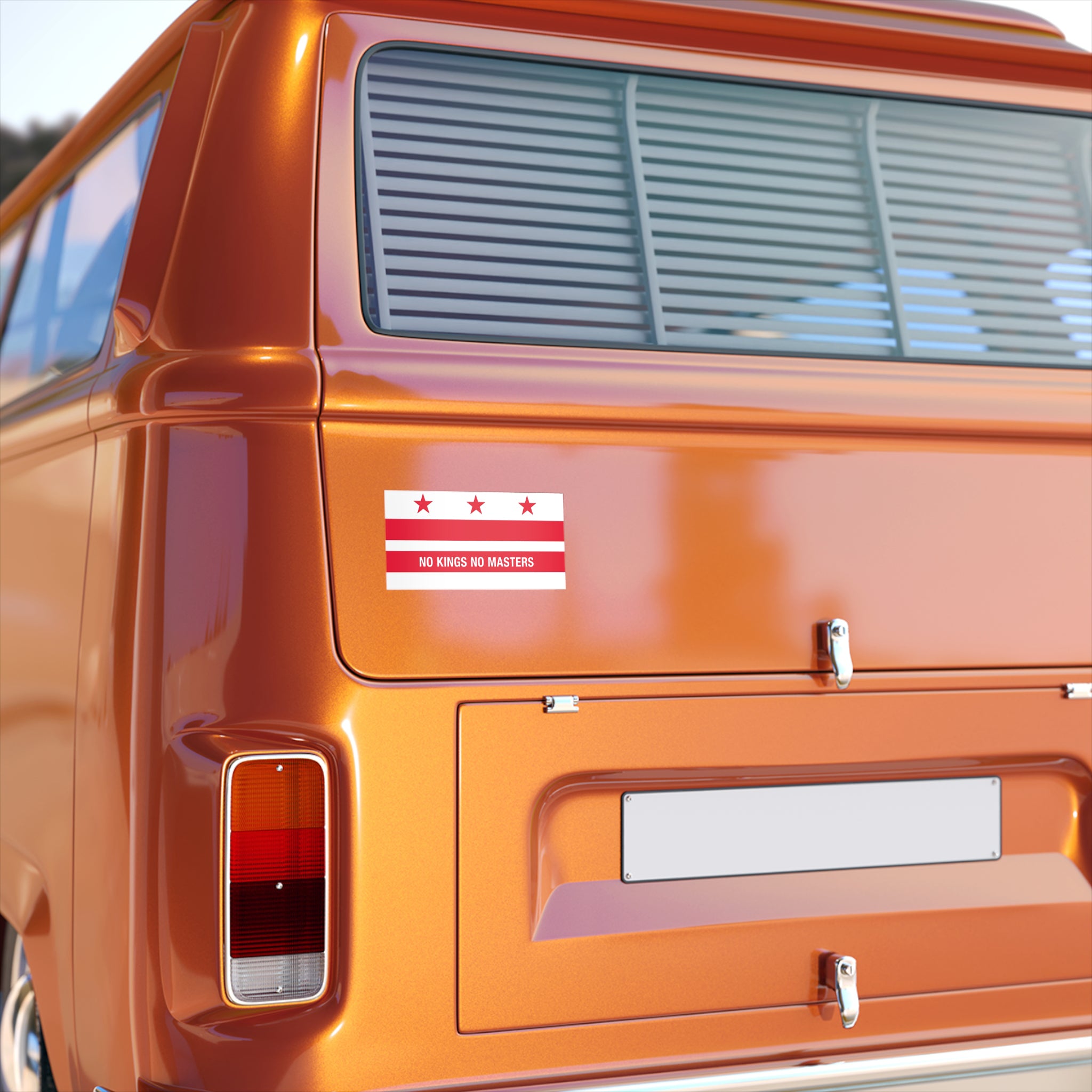 Rear view of an orange vintage van displaying the Washington DC Flag No Kings Sticker & Magnet on its tailgate, featuring a stylized flag and protest slogan against unchecked power and authority.