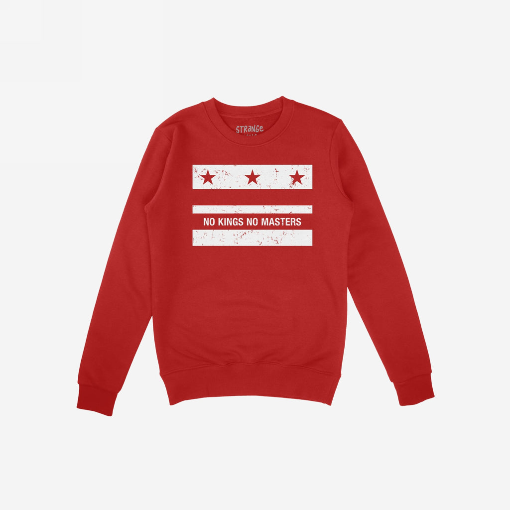 Red crew-neck sweatshirt featuring the Washington DC No Kings Flag Shirt design, with distressed white print: three stars, “NO KINGS NO MASTERS” slogan, symbolizing anti-authoritarianism and resistance.