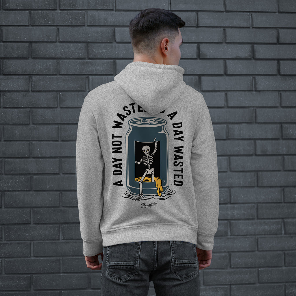 Young man models the Wasted Days Hoodie & Sweatshirt, featuring a skeleton escaping a soda can with the phrases “A DAY NOT WASTED” and “A DAY WASTED” on the back.