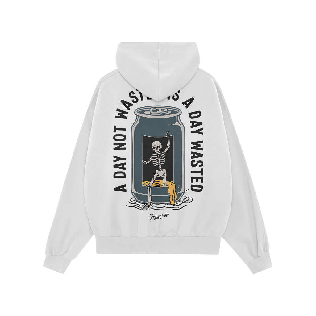Wasted Days Hoodie & Sweatshirt features a skeleton lounging in a beer can, spilling golden liquid, with the slogan “A DAY 