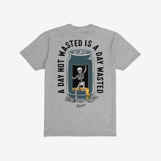 Wasted Days T-shirt featuring a dancing skeleton emerging from a cut-open can, spilling beer, with the slogan A DAY NOT WASTED IS A DAY WASTED encircling the graphic. Signature reads “Hopsmash.”