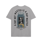 Wasted Days T-shirt featuring a dancing skeleton emerging from a cut-open can, spilling beer, with the slogan A DAY NOT WASTE