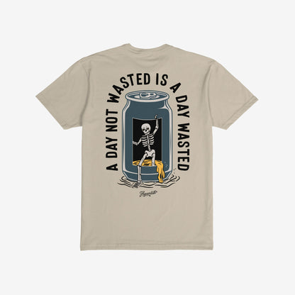 Wasted Days T-shirt featuring a grinning skeleton in an open can with the slogan “A DAY NOT WASTED IS A DAY WASTED,” epitomizing carefree rebellion and unproductive fun.