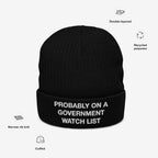 Watch List Hat: A black cuffed knit beanie with white embroidered text, highlighting a bold protest statement. Features include double-layered recycled polyester and a narrow rib knit pattern.