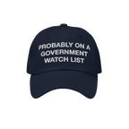 A dark navy blue Watch List Hat with bold white embroidery stating, PROBABLY ON A GOVERNMENT WATCH LIST, conveying a bold pro