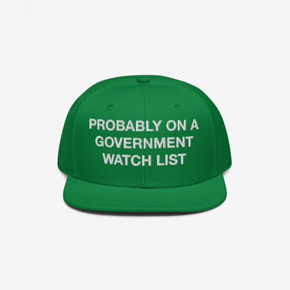 Flat-brim baseball cap titled Watch List Hat featuring bold white text, “PROBABLY ON A GOVERNMENT WATCH LIST,” symbolizing protest and visibility. Ideal for expressing dissent and societal engagement.