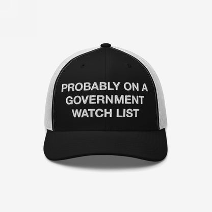 Mesh trucker cap with PROBABLY ON A GOVERNMENT WATCH LIST embroidered on the front, representing a bold statement of activism and visibility. A distinctive piece from a store advocating for equality and justice.